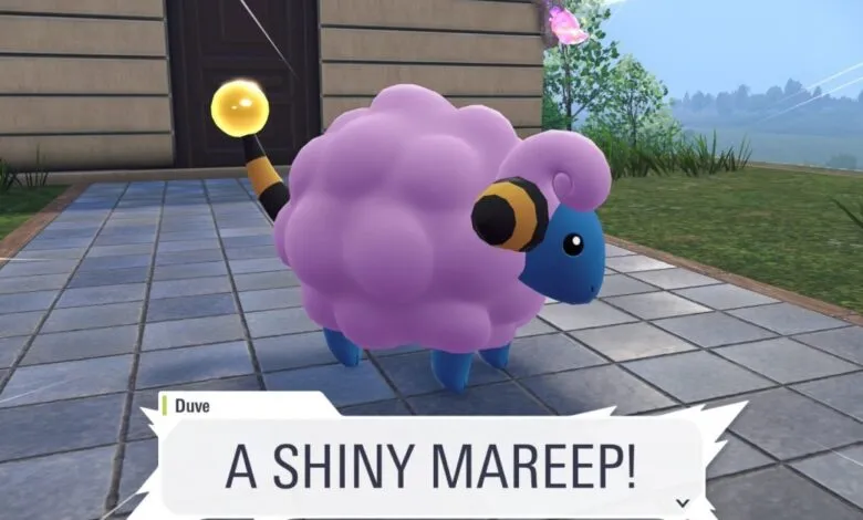 A shiny purple Mareep Pokémon with blue legs and yellow accents on its tail and ears.
