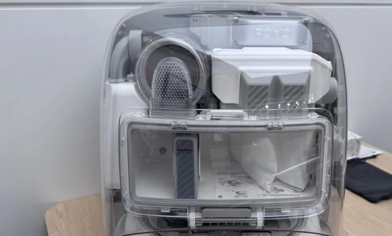 Transparent view of a white and gray appliance with internal components visible.