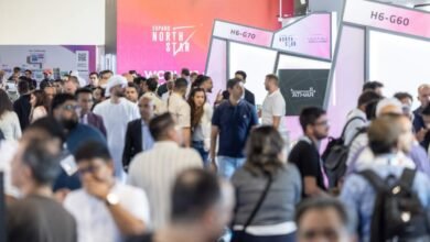 Crowd of people attending a business conference with 'Expand North Star' branding.