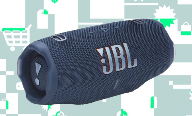 Dark blue JBL Charge 6 portable speaker with silver logo on a light blue background with shopping icons.