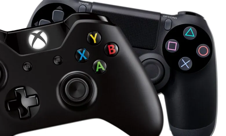 Two black video game controllers, an Xbox and a PlayStation controller, side-by-side.