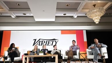 Five people sit on a stage during a panel discussion with the Variety logo behind them.