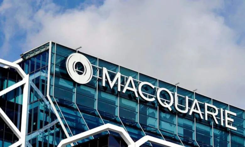 Macquarie Bank logo and name on a modern glass building exterior.