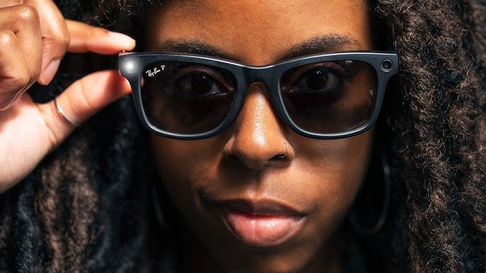 Close-up of a woman wearing black Ray-Ban Stories smart glasses with a small LED light on the side.