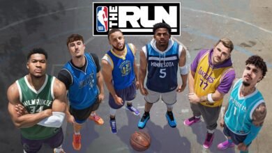 Six NBA players in jerseys stand on a basketball court, looking up.