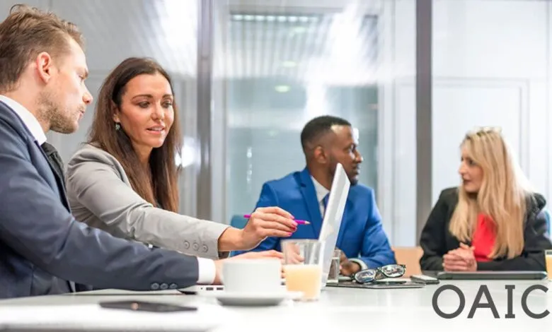 Diverse business professionals collaborating around a conference table.