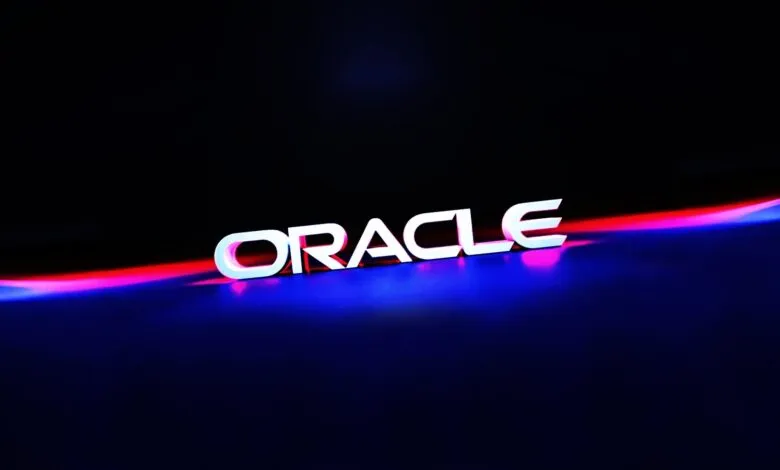 The Oracle logo in white 3D letters with neon red and blue lighting.