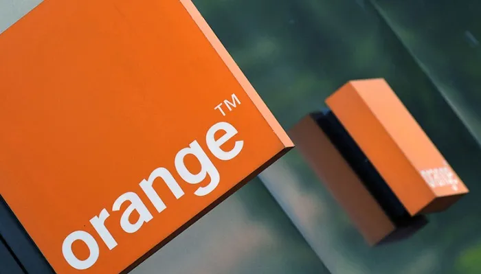 Close-up of the Orange telecommunications logo on a building facade.