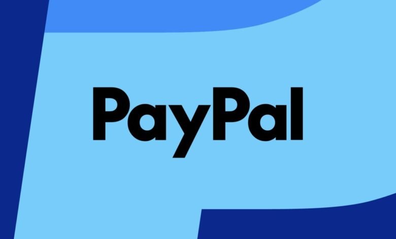 The PayPal logo in black text on a light blue background with dark blue abstract shapes.
