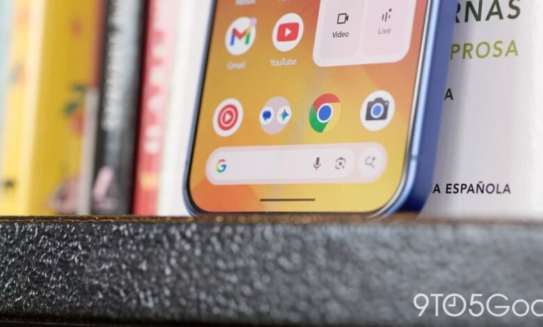 Close-up of a blue smartphone displaying the Google search bar and app icons.
