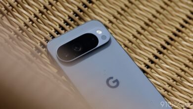 Close-up of a Google Pixel phone's camera bar with water droplets.
