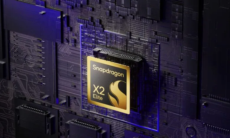 Close-up of a Qualcomm Snapdragon X2 Elite processor on a dark, futuristic circuit board.