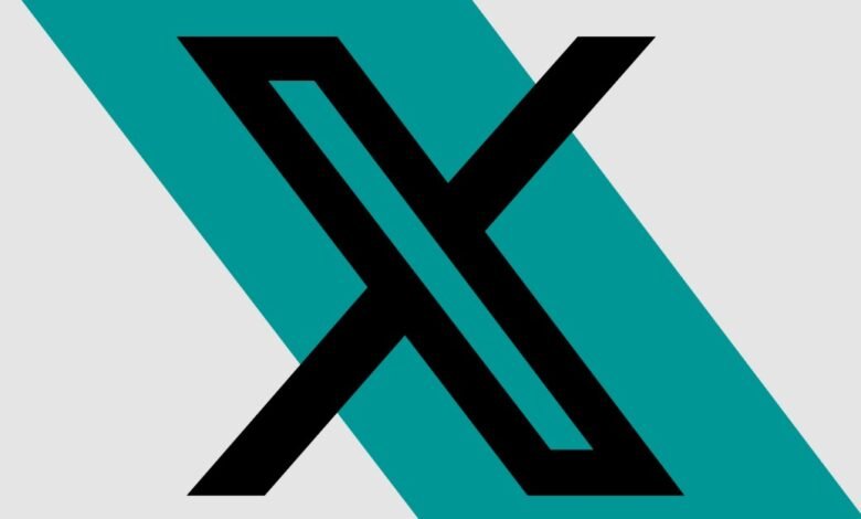 Abstract black 'X' logo design with teal and gray background.