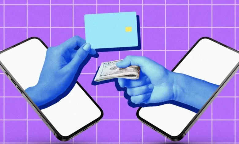 Hands exchanging money and a credit card between two smartphones.