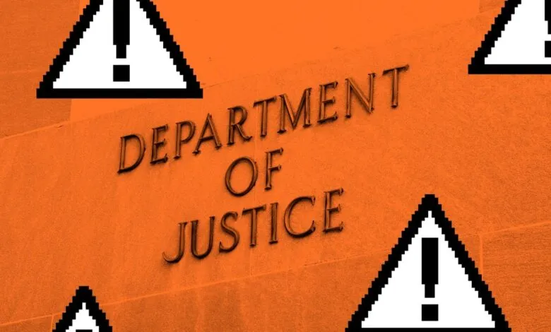 Department of Justice building facade with pixelated warning signs