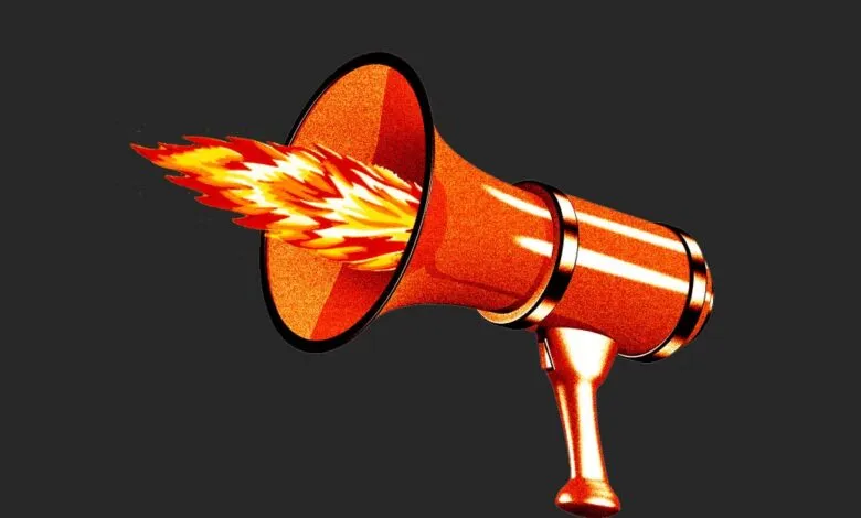 A bright orange megaphone with flames erupting from its bell against a dark gray background.
