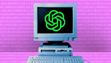 Retro computer displaying the OpenAI logo on a pink binary code background.