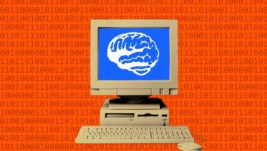 Retro computer displaying a white brain icon on a blue screen against a binary code background.