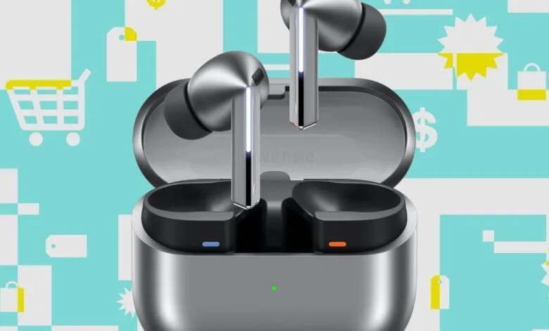 Close-up of sleek, silver wireless earbuds in an open charging case against a teal and white graphic background with shopping icons.