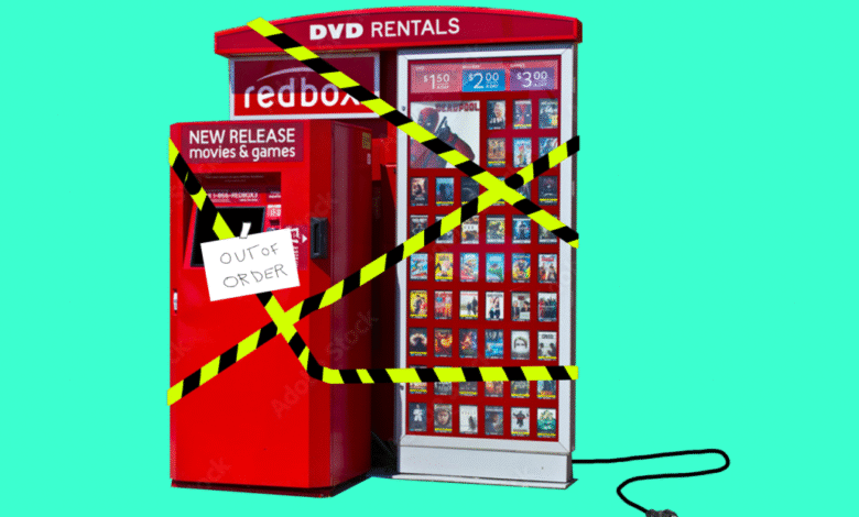 Redbox DVD rental kiosk covered in yellow and black caution tape with an 'Out of Order' sign.