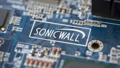 Close-up of a blue circuit board with the SonicWall logo.
