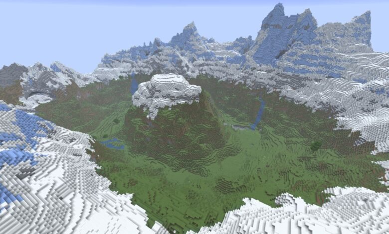 A vast, snow-capped mountain range surrounds a lush green valley in Minecraft.