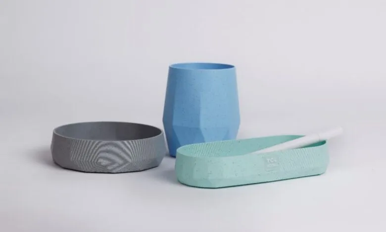 Three modern, faceted containers in blue, gray, and mint green.