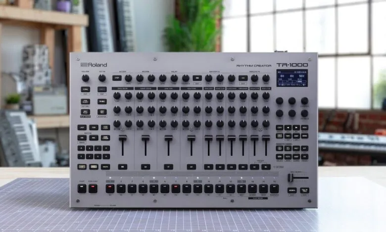 Roland TR-1000 Rhythm Creator drum machine with many knobs and sliders.