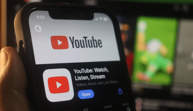 Close-up of a smartphone displaying the YouTube app interface.