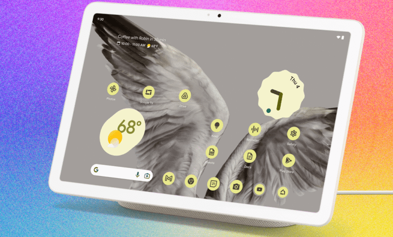 A white smart display with a colorful, textured background.