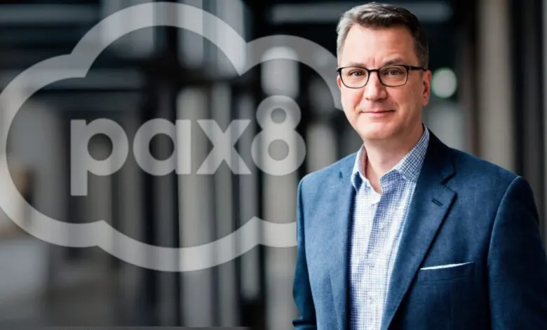 Tom Gavin, CEO of Pax8, smiles confidently in a professional portrait.
