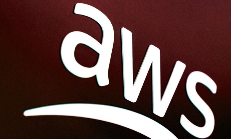 The white AWS logo is displayed prominently against a dark red background.