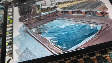 Digital sketch of a swimming pool and surrounding landscape on a tablet screen.
