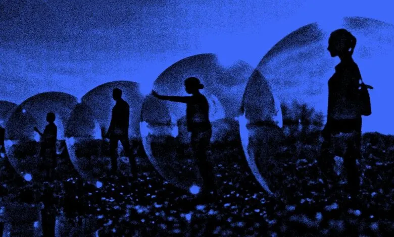 Silhouettes of people inside transparent bubbles against a blue sky.