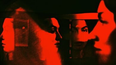 Abstract red and black image of multiple faces in profile, suggesting fragmented identity or perception.