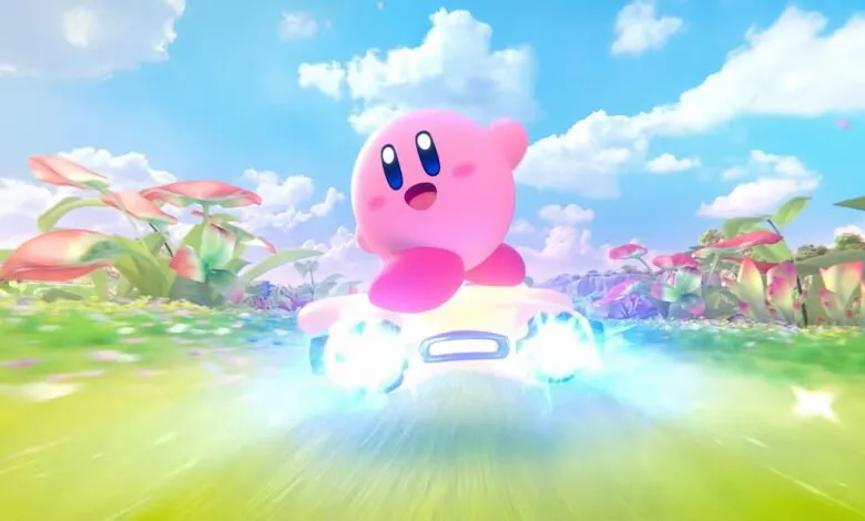 Pink character Kirby rides a glowing vehicle through a vibrant, alien landscape.
