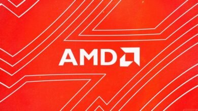 Close-up of the AMD logo on a vibrant red background with white circuit board lines.