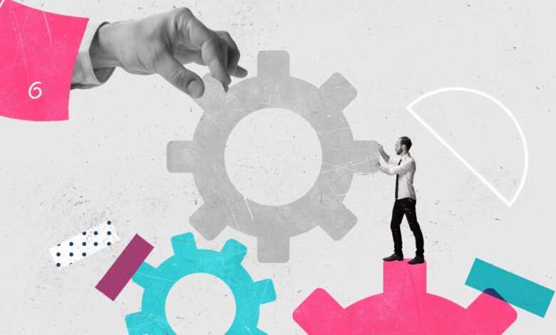 Man in suit interacting with large gears, symbolizing teamwork and process.