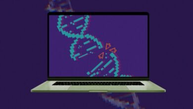 Laptop displaying a pixelated DNA strand with digital virus icons attacking it.