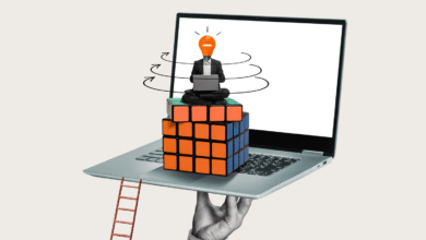 Surreal image of a person with a lightbulb head sitting on a Rubik's Cube on a laptop.