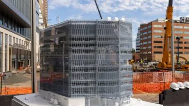 Architectural model of Nokia Bell Labs headquarters with construction site in background.