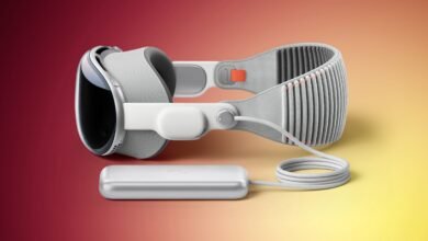 Apple Vision Pro headset with external battery pack and cable.