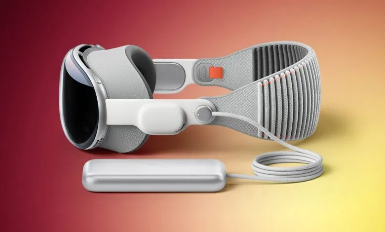 Apple Vision Pro headset with external battery pack and cable.