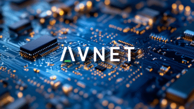 Close-up of a complex circuit board with glowing orange lights and the AVNET logo.