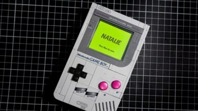 A custom Nintendo Game Boy with a bright green screen displaying 'NATALIE The Nerd.com'.