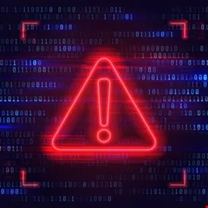 Red neon warning sign with an exclamation point against a backdrop of binary code.