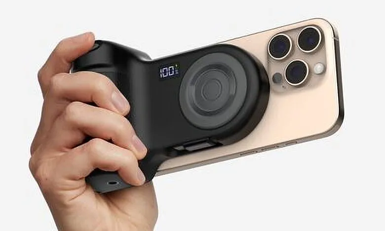 Hand holding an iPhone with a black camera grip accessory attached.