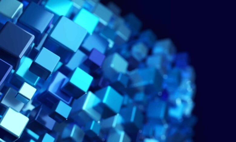 Abstract 3D render of glowing blue cubes forming a sphere against a dark blue background.