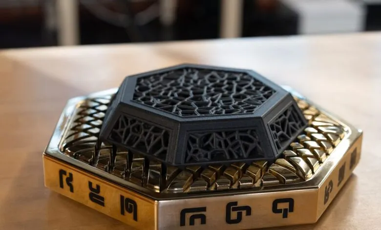 Close-up of an ornate hexagonal incense burner with intricate black lattice work.
