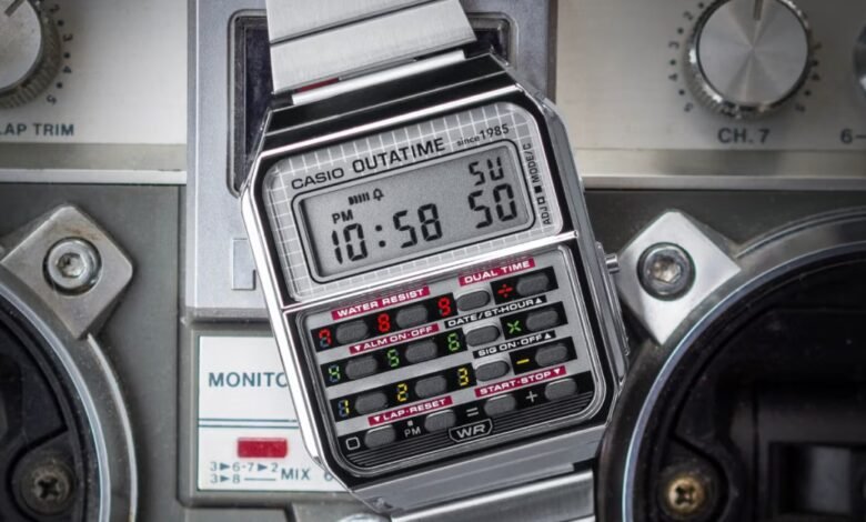 Close-up of a vintage Casio Outatime digital watch with a metal band.